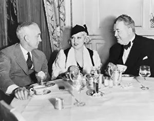 Comediennes: Mae West dining at the Victor Hugo Cafs with her