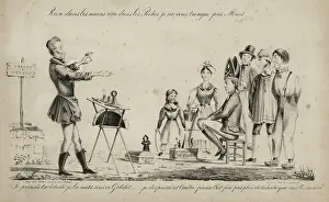 Illusionist: Magician performing the cup and balls trick to a small crowd