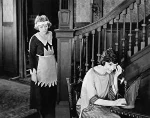 Sneaking: Maid eavesdropping on womans telephone call