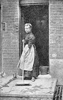 Brushing: A maid-of-all-work sweeps a step, c. 1900