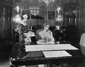 Daydreaming: Maid serving woman at table