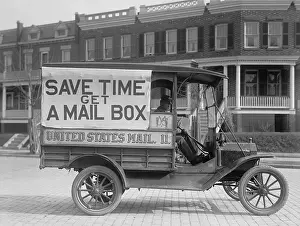 Mailman: Mail Wagon in Washington, D.C. in 1916. On its side