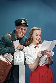 Mailman: Mailman and Lady Checking Mail