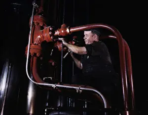 Repairing: Maintenance mechanic checking pipes at largest