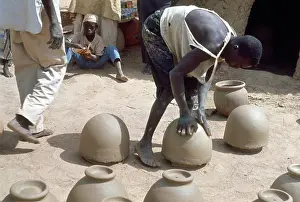 Pots: Making pots without a wheel. Nigeria circa 1966