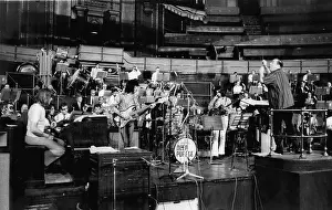 Rehearsals: Malcolm Arnold conducts pop group and orchestra, London