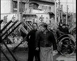 Rickshaws: A Male Chinese Civilian Pulling Rickshaws Through
