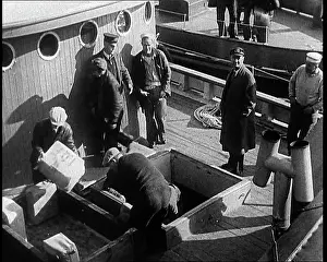 Illegal: Male Civilians Unloading Illegal Cargo From a Boat