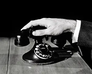 Handset: Male Hand Lifting Receiver on Rotary