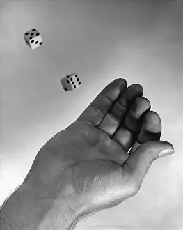 Camerique: Male Hand Throwing Dice