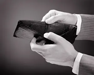 Busted: Male Hands Holding Open a Wallet and Revealing