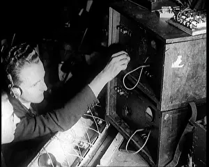 Technicians: Two Male Technicians Operate Radio Devices