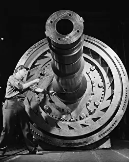 Flywheel: Male worker with massive machinery