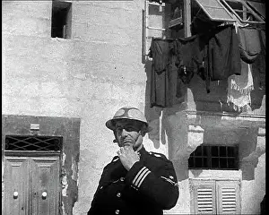 Equipping: Maltese Air Raid Warden Equipping a Protective Helmet