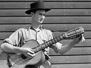 Acoustic: Man - acoustic guitar - migratory labour camp