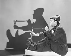 Elastic: Man aiming slingshot