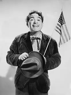 Mustaches: Man with the American flag in his hand smiling