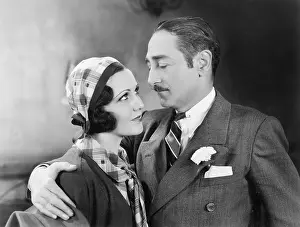 Mustaches: Man with his arm around a woman