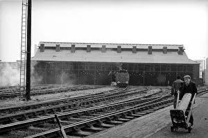 Barrow: Man with barrow in front of Nine Elms New Shed