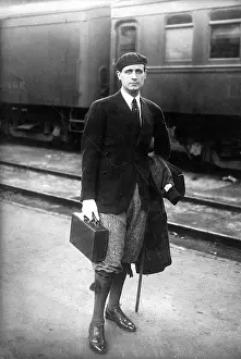 Knickerbockers: Man in beret and knickerbockers at a station