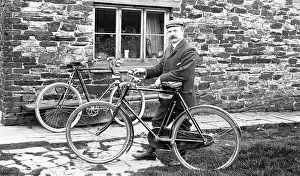 Significantly: Man with bicycles outside house