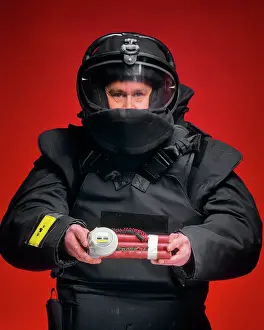 Solutions: Man Bomb Squad Technician Looking at the Camera