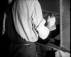 Vinyls: A Man Breaking Up Vinyls to Use For War Materials