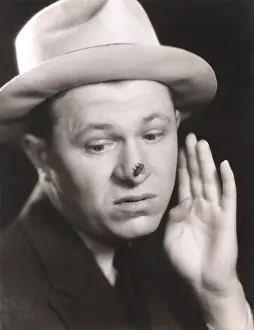 Irritated: Man with bug on his nose