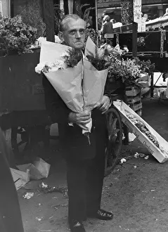 Bunches: Man with bunches of flowers