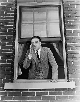 Yell: Man calling hey you looking out of window