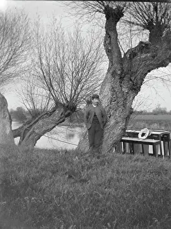 Lifebelt: Man on canal bank with canal boat, South Wales