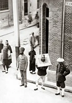 Cangue: Man in a cangue circa 1900, China