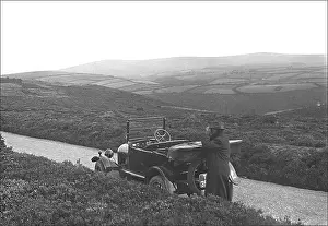 Ponsonby: Man and car on a country lane in Devon