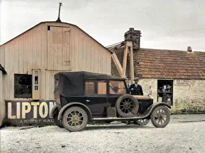 Limit: Man and car outside Post Office, John o'Groats, Scotland