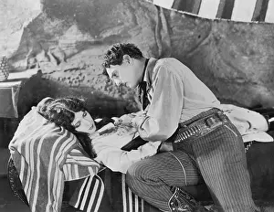 Supportive: Man caring for unconscious woman