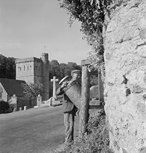 Branscombe: Man carrying milk churn