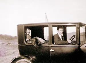 Sepia Images: Man and two children in a car