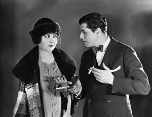 Earnest: Man with cigarettes talking to woman