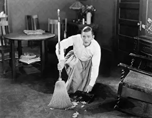 Brooms: Man cleaning up with a broom
