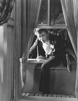 Drape: Man climbing through open window