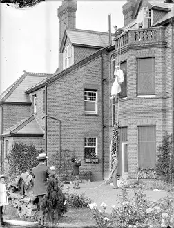 Abseil: Man Climbing Down a Rope Escape