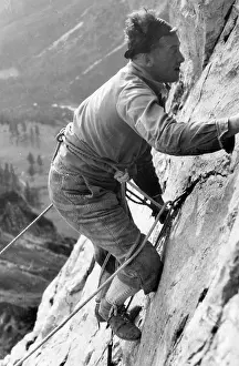 Steeply: MAN CLIMBS STEEPLY 1930S