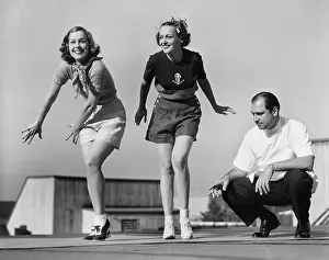 Collaborate: Man coaching two female dancers