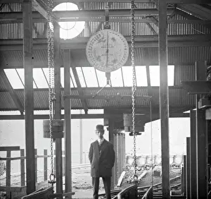 Smartly: Man under coal weighing machine, Llanerch Colliery