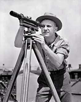 Theodolite: Man Construction Supervisor Using a Surveyor's