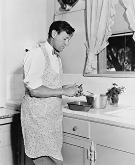 Reversal: Man cooking in the kitchen