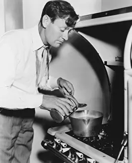 Flavoring: Man cooking on stove