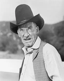 Hostility: Man in a cowboy hat looking angry