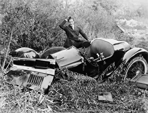 Destructive: Man with a crashed car
