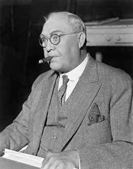 Daydreaming: Man daydreaming with a cigar in his mouth